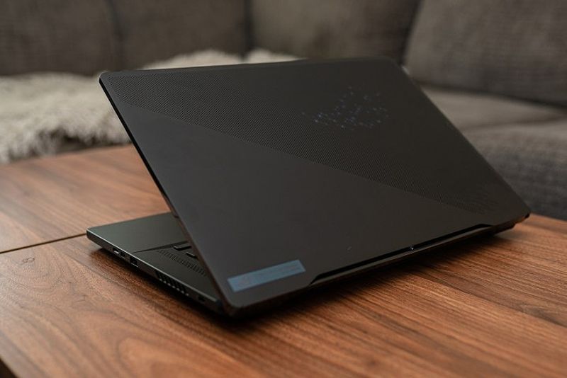 ASUS ROG Zephyrus M16 sitting on a coffee table for portability illustration